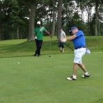Players on the green during The Second Annual Big Daddy Golf Classic at Oheka Castle.