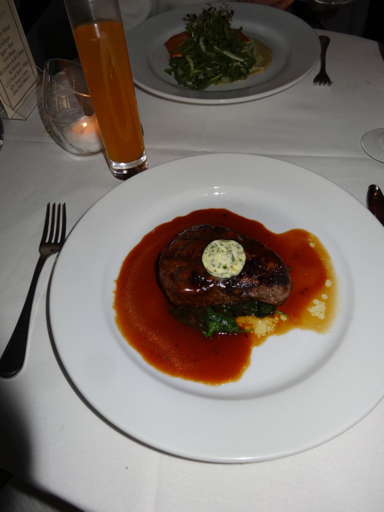 The filet mignon with roastedgarlic butter and red wine demiglace at Restaurant